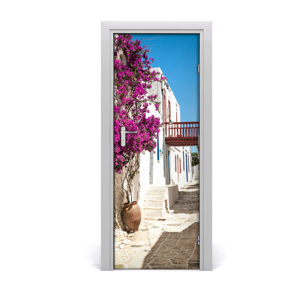 Décoration porte Ruelle avec des fleurs roses