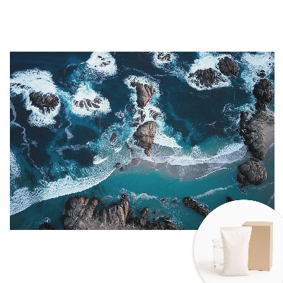 Papier peint panoramique intissé Vue aérienne de l'océan et rochers aux couleurs éclatantes