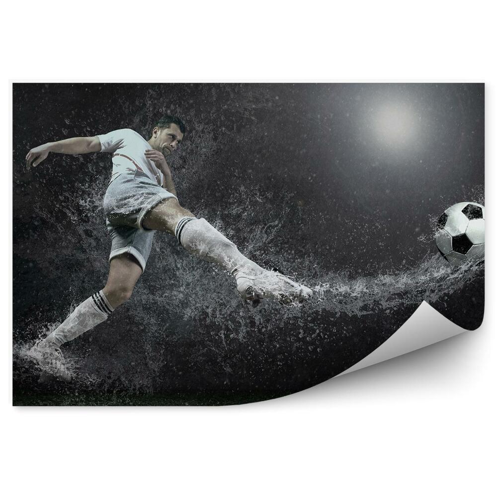 Papier peint Un ballon de football tombe dans l'eau