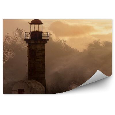 Papier peint Phare sur fond de vagues et de coucher de soleil
