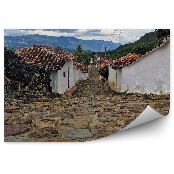 Papier peint Rue coloniale historique Pierres Ciel Nuages Montagnes Campagne