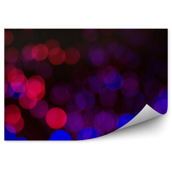 Papier peint Cercles bleus et rouges flous sur fond noir