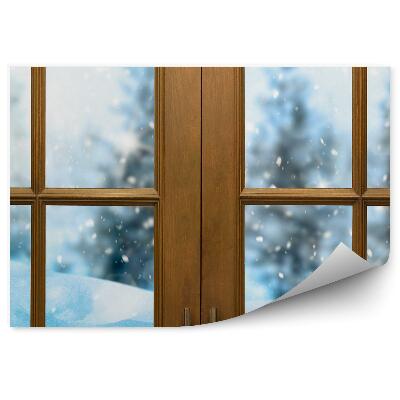 Papier peint Fenêtre fermée donnant sur une forêt enneigée