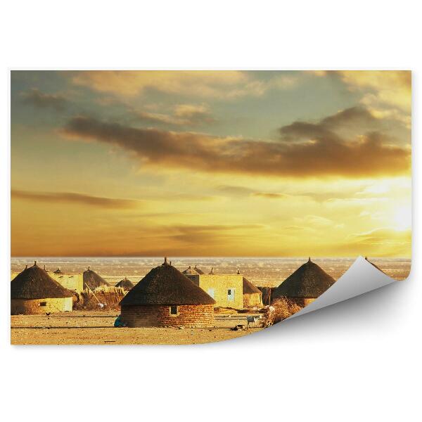 Papier peint village africain huttes sable