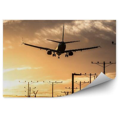 Papier peint Atterrissage d'un avion sur une piste