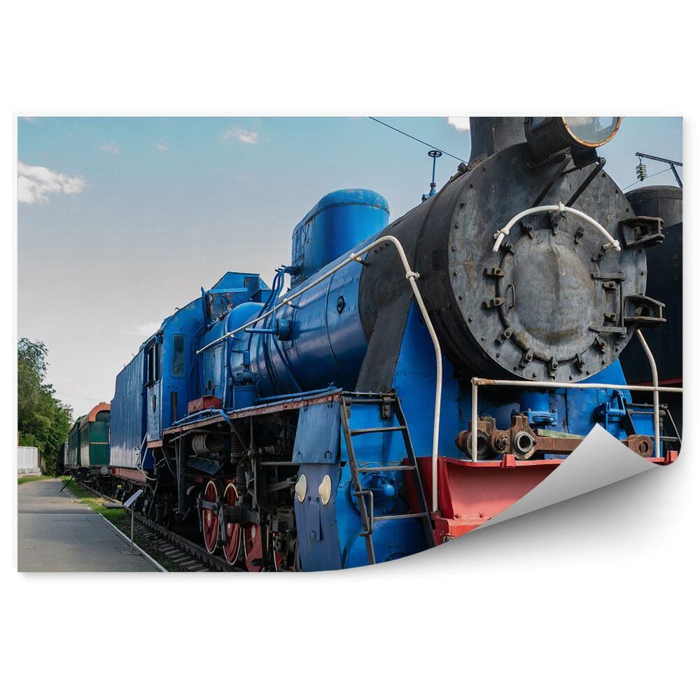 Papier peint Locomotive à vapeur bleue sur les rails