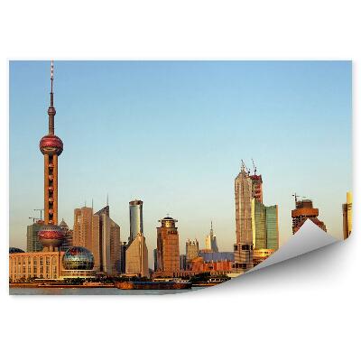 Papier peint Bâtiments de la ville à l'horizon de la rivière