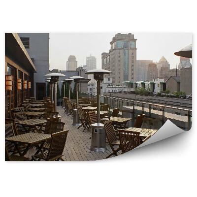 Papier peint Bâtiments Terrasse Chaises Tables Lampes Ciel