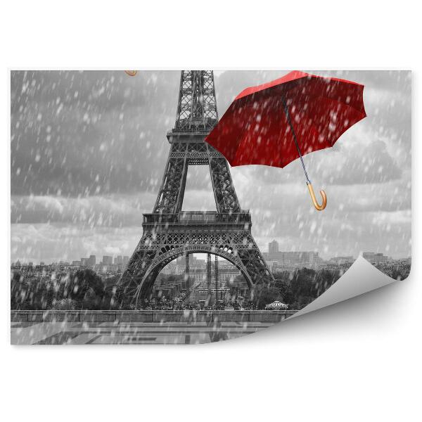 Papier peint La tour Eiffel avec des parapluies volants.