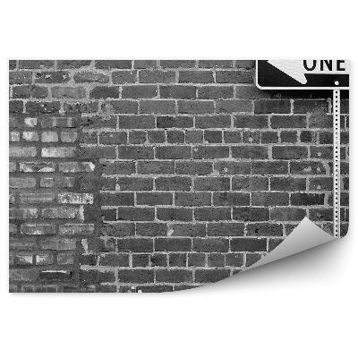 Papier peint Mur de briques grises avec panneau de sens unique