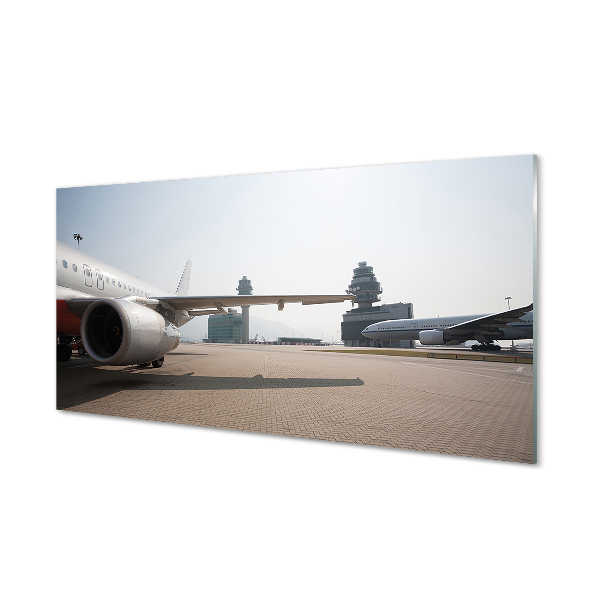 Tableau photo sur verre Bâtiments du ciel de l'aéroport d'avions