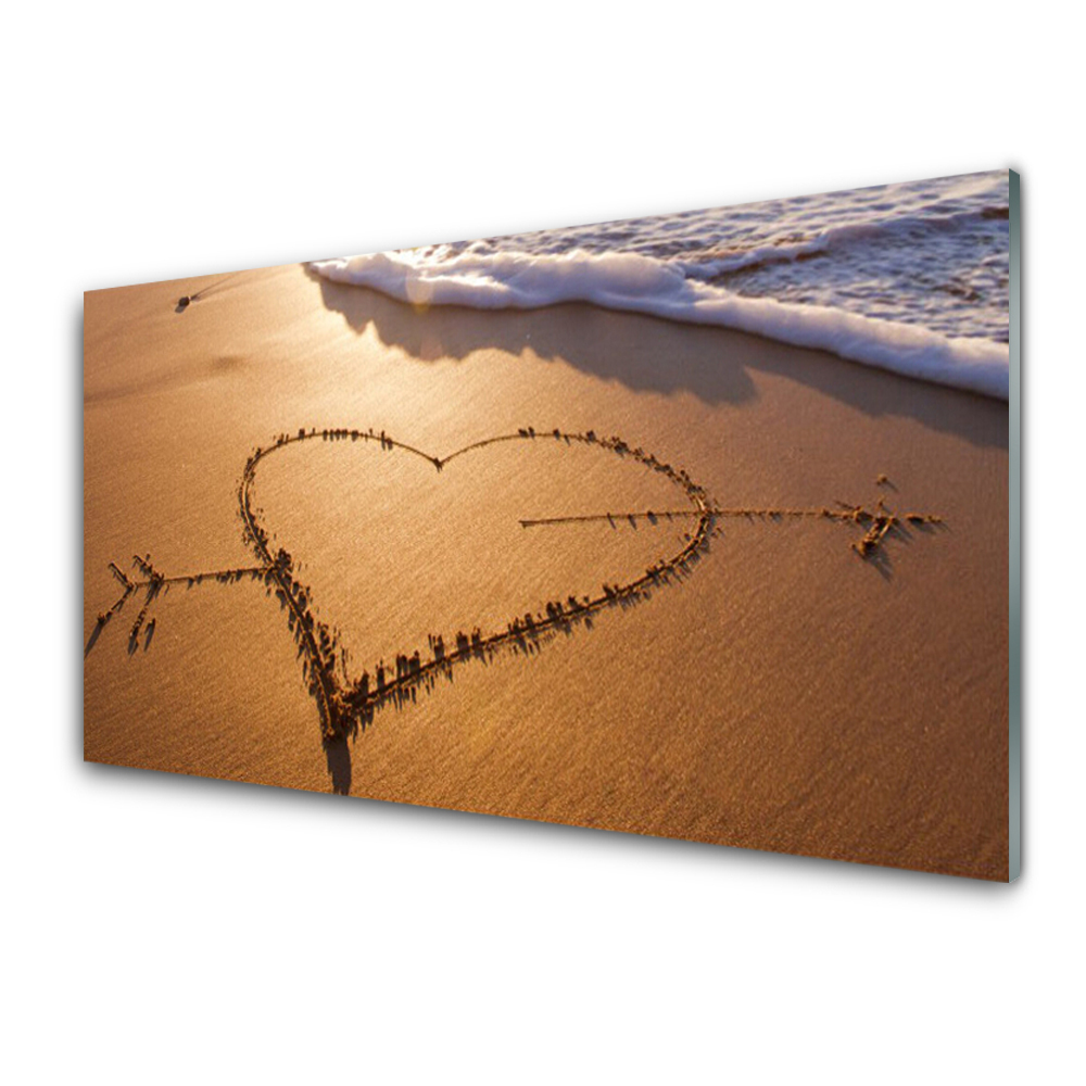 Tableau photo sur verre Coeur transpercé par une flèche sur la plage