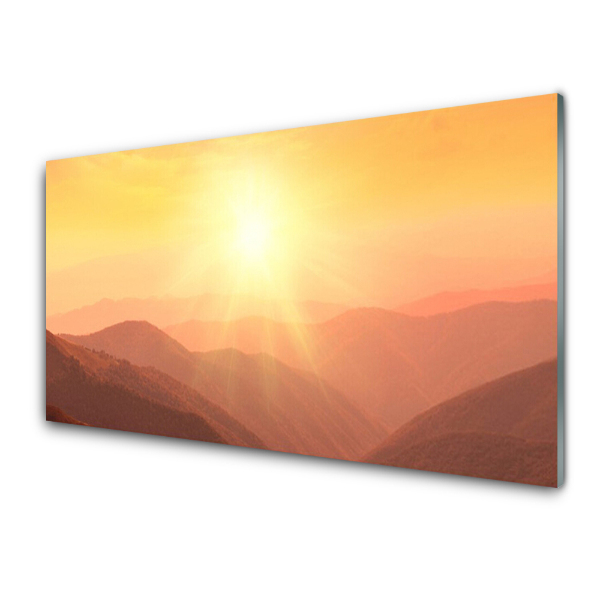 Tableau sur verre Soleil sur fond de montagnes orange