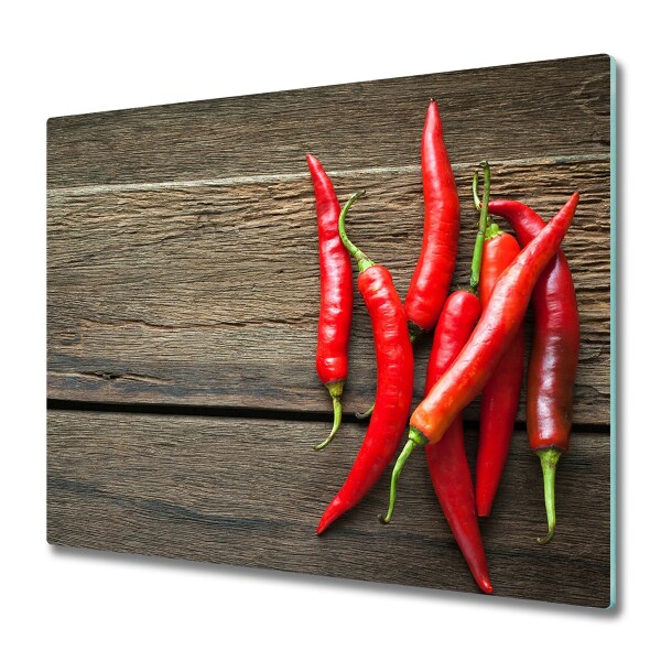 Couvre plaque de cuisson Piments sur une planche