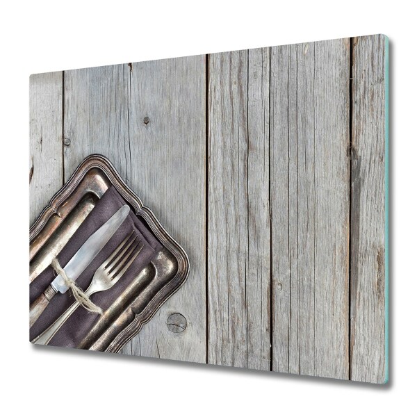 Protection pour plaque de cuisson Couverts sur une planche