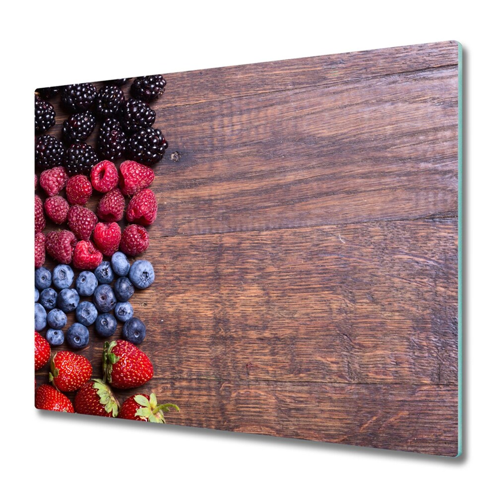 Planche à découper en verre Fruits de la forêt sur une table en bois