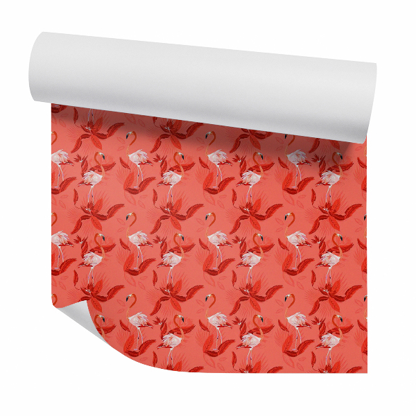 Papier peint Magnifiques flamants roses sur fond rouge