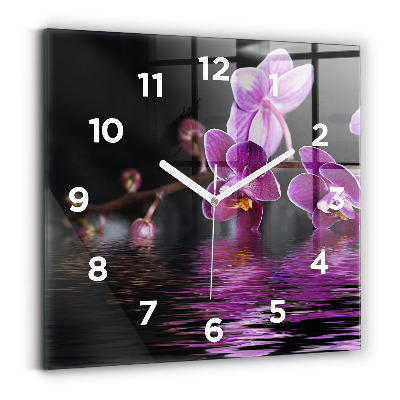 Horloge carrée en verre Fleur d'orchidée sur l'eau