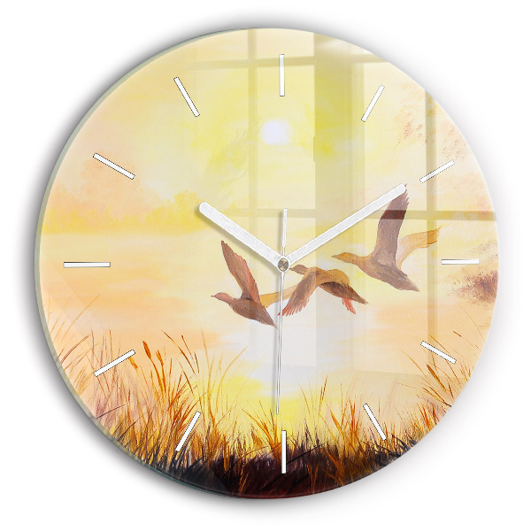 Horloge ronde en verre Grues au coucher du soleil