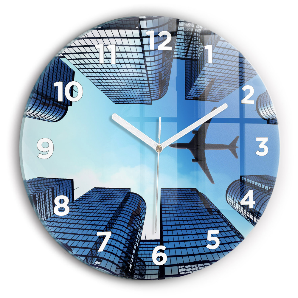 Horloge ronde murale Avion au-dessus de bâtiments