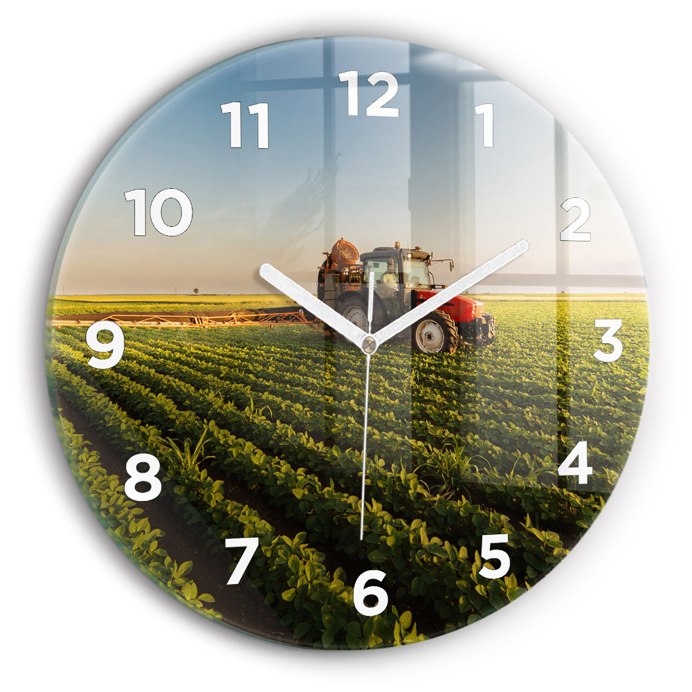 Horloge ronde murale Tracteur dans un champ agricole