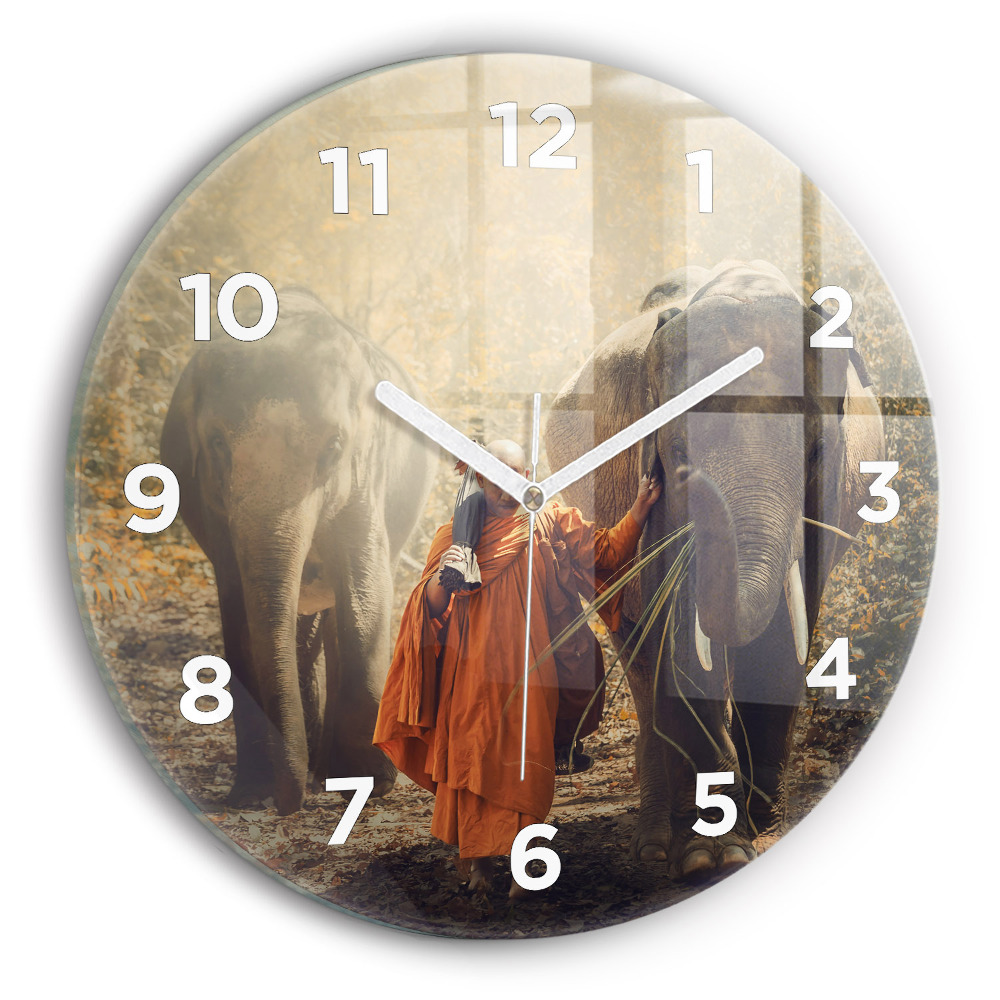 Horloge ronde Moine guidant des éléphants