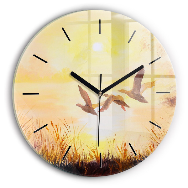 Grues au coucher du soleil Horloge ronde en verre