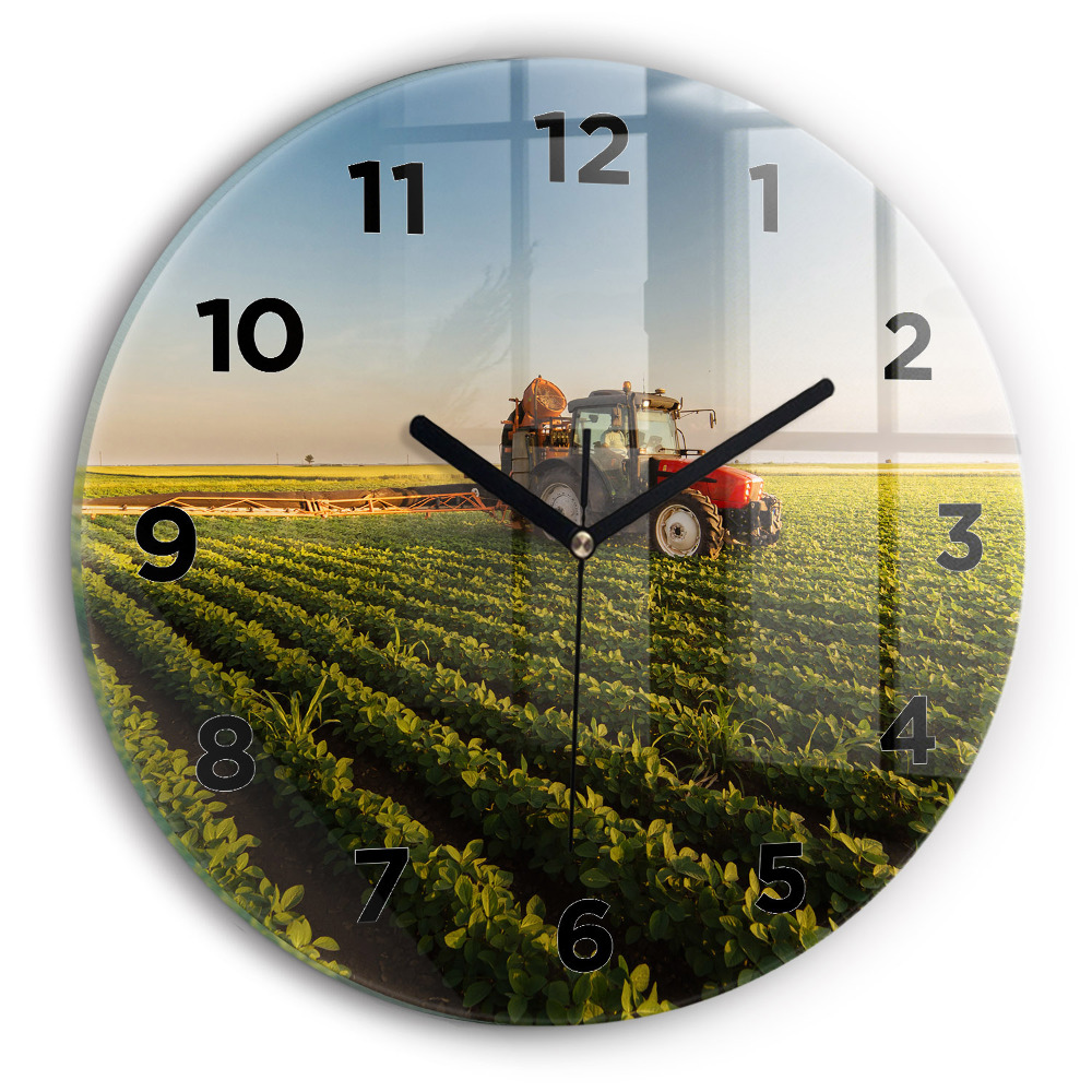 Horloge ronde murale Tracteur dans un champ agricole